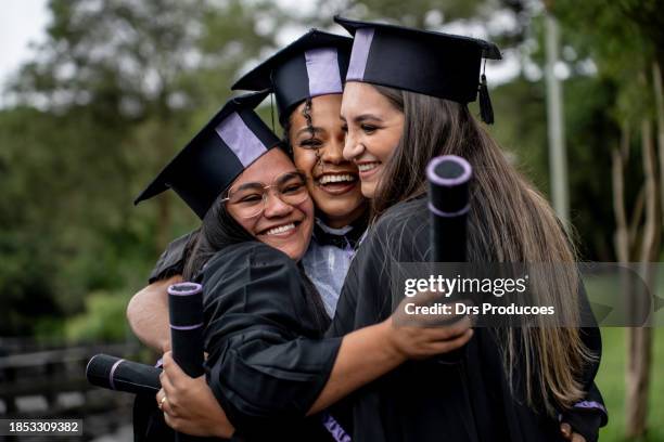 friends celebrating graduation day - diverse graduation stock pictures, royalty-free photos & images