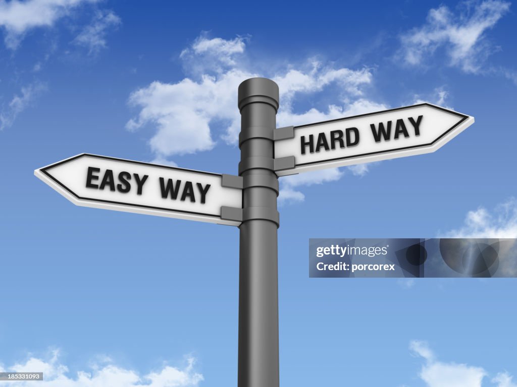 Directional Sign with EASY HARD WAY and Sky