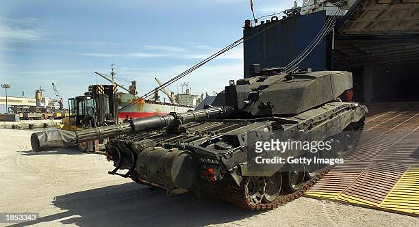 The first British Challenger 2 Main Battle tanks roll off of their transport ship after arriving from Germany February, 2003 at Camp Commando,...