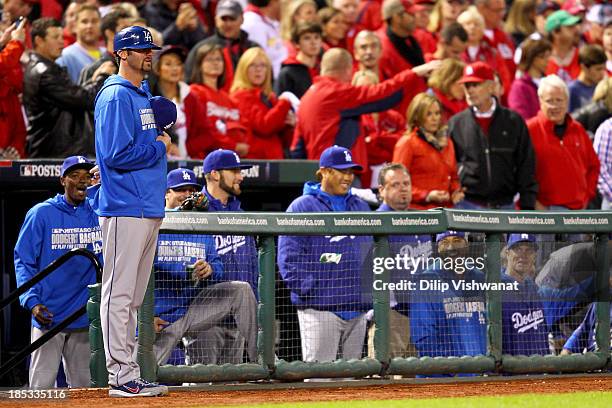 Scott Van Slyke of the Los Angeles Dodgers stands on the field across from Joe Kelly of the St. Louis Cardinals before the start of Game Six of the...