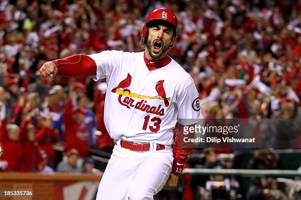 Matt Carpenter of the St. Louis Cardinals reacts after scoring a run in the third inning against the Los Angeles Dodgers in Game Six of the National...