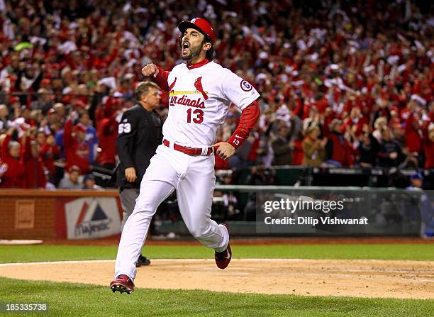 Matt Carpenter of the St. Louis Cardinals reacts after scoring a run in the third inning against the Los Angeles Dodgers in Game Six of the National...