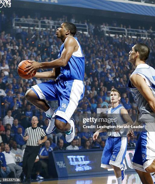Kentucky Wildcats guard Aaron Harrison goes in for a layup during "Big Blue Madness" in Lexington, Kentucky, Friday, October 18, 2013.