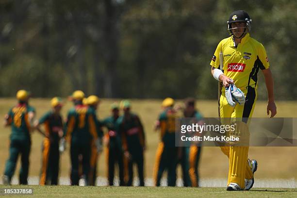 Marcus North of the Warriors looks dejected as he leaves the field after being run out during the Ryobi Cup match between the Tasmania Tigers and the...