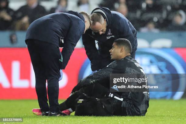 Seny Dieng of Middlesbrough sits injured on the ground during the Sky Bet Championship match between Swansea City and Middlesbrough at the...