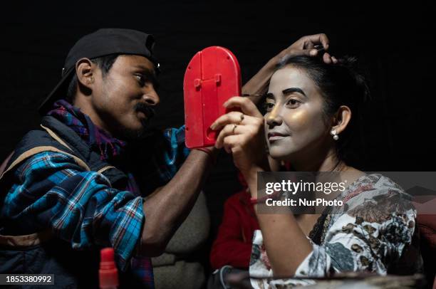 Popular Assamese actress Barasha Rani Bishaya is getting her makeup done backstage to perform in an Assamese Bhaona in Guwahati, Assam, India, on...