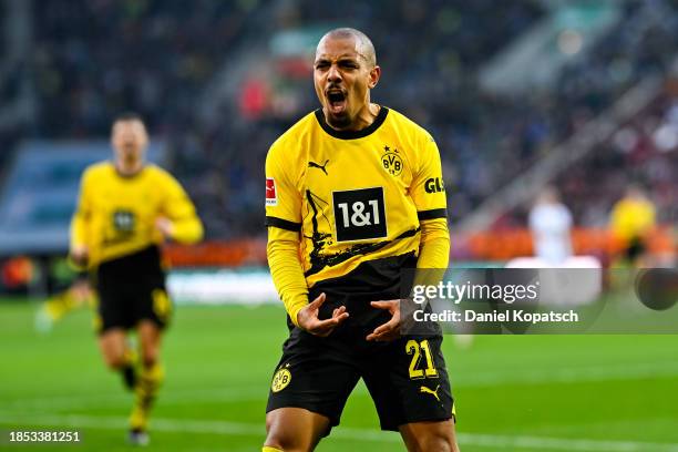 Donyell Malen of Dortmund celebrates his team's first goal during the Bundesliga match between FC Augsburg and Borussia Dortmund at WWK-Arena on...