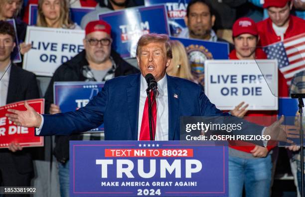 Former US President and 2024 Republican presidential hopeful Donald Trump speaks during a campaign rally at the University of New Hampshire's...