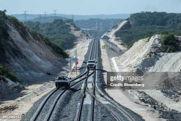 Crews work on the Maya Train line in Campeche, Mexico, on Friday, Dec. 15, 2023. Mexican President AMLO's flagship works have significantly exceed...