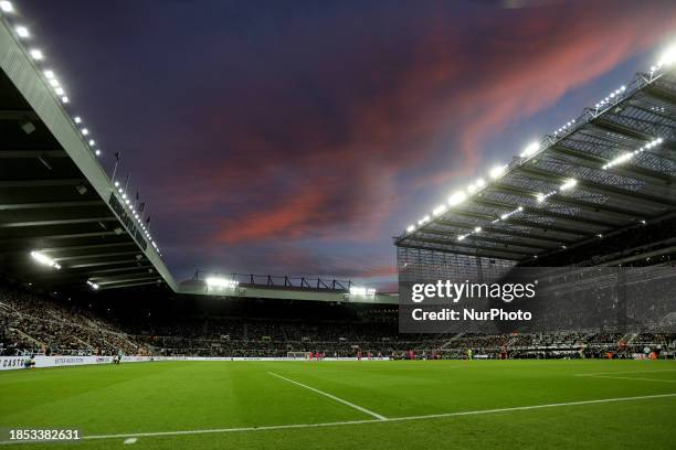 The sky above the ground is lighting up due to the sunset during the Premier League match between Newcastle United and Fulham at St. James's Park in...