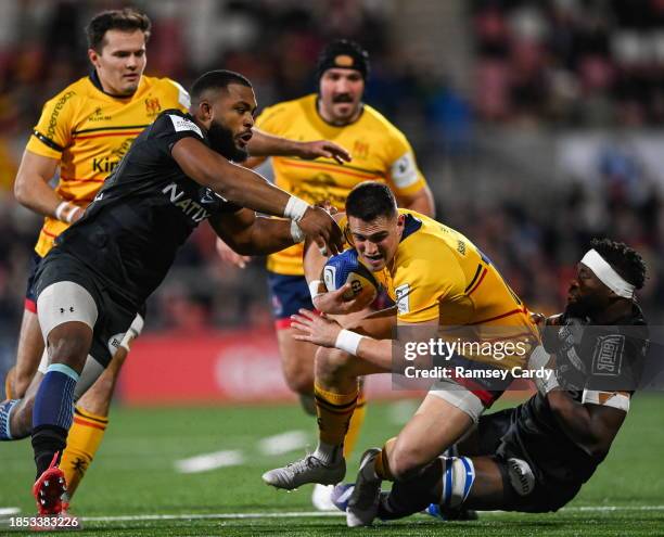 Belfast , United Kingdom - 16 December 2023; James Hume of Ulster is tackled by Siya Kolisi of Racing 92 during the Investec Champions Cup Pool 2...