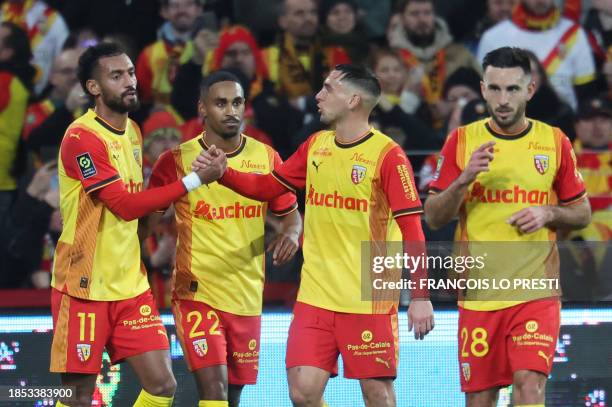 Lens' French forward Wesley Said celebrates with teammates after scoring a goal during the French L1 football match between RC Lens and Stade de...
