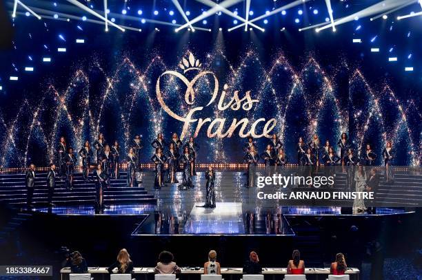 Miss Tahiti Ravahere Silloux talks in front of the jury after being selected to progress to the semi-final during the Miss France 2024 beauty pageant...