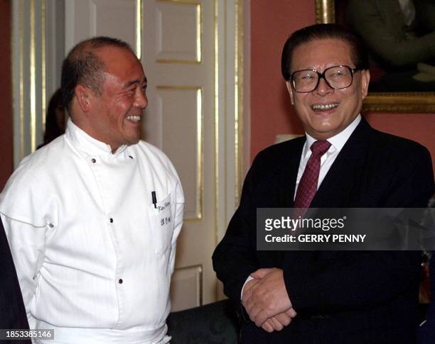 Chinese President Jiang Zemin meets famous chef Ken Hom inside No.10 Downing Street before the latter cooked lunch for the Chinese guest and British...