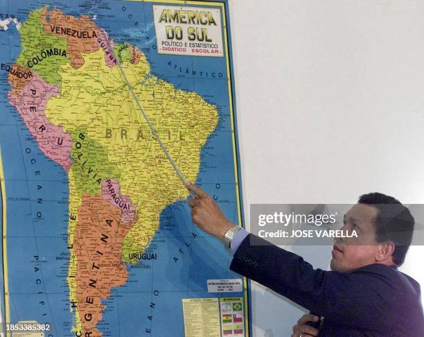 Venezuelan President Hugo Chavez shows a map of South America to explane Venezuelan border problems that he maintains with Guyana during a press...