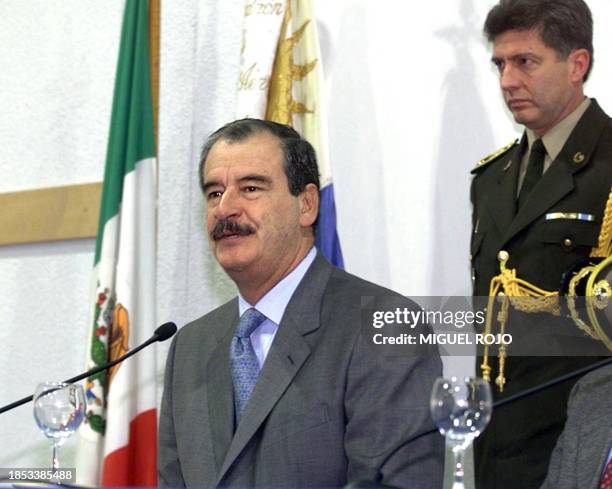 President-elect of Mexico Vicente Fox answers questions during a press conference 11 August 2000 at Montevideo Airport before returning to Mexico...