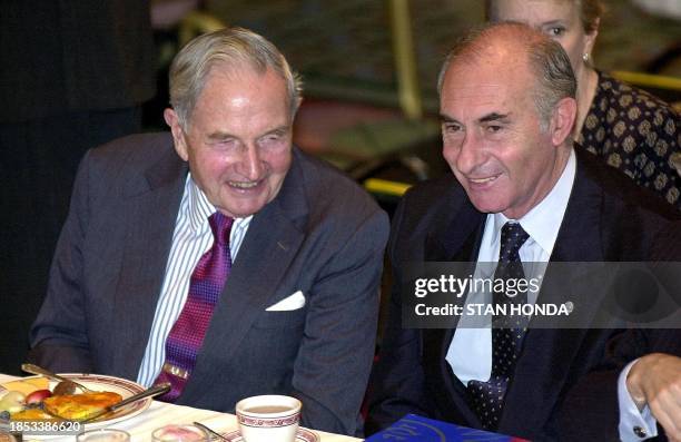 Argentine President Fernando de la Rua sits next to US business man David Rockefeller at a meeting of the Americas Society 12 June at the...