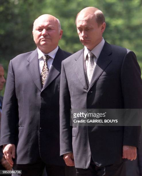 Russian President Vladimir Putin and Moscow's Mayor Yuri Luzhkov reflect after unveiling a statue of Russian poet Alexander Pushkin in the Villa...