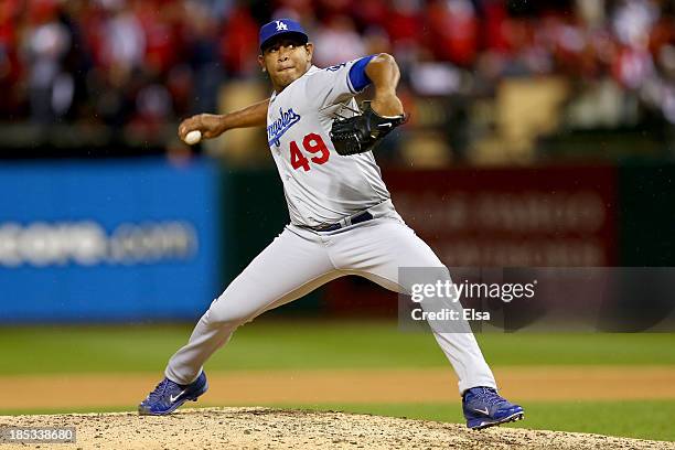 Carlos Marmol of the Los Angeles Dodgers pitches in the seventh inning against the St. Louis Cardinals in Game Six of the National League...