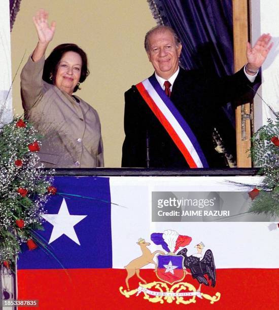 Ricardo Lagos, new president of Chile, is joined byhis wife, Luisa Duran, and they greet the crowd from a balcony at the Presidential Palace in...