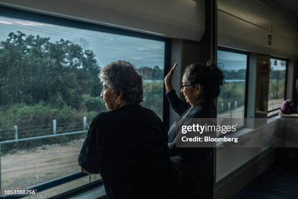 Passengers on the Maya Train near Campeche, Mexico, on Saturday, Dec. 16, 2023. Mexican President AMLO's flagship works have significantly exceed...