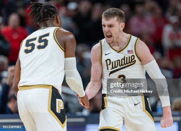 Lance Jones and Braden Smith of the Purdue Boilermakers celebrate during the second half against the Arizona Wildcats in the Indy Classic at...