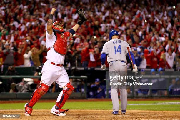 Yadier Molina of the St. Louis Cardinals celebrates as Mark Ellis of the Los Angeles Dodgers strikes out as the Cardinals defeat the Los Angeles...