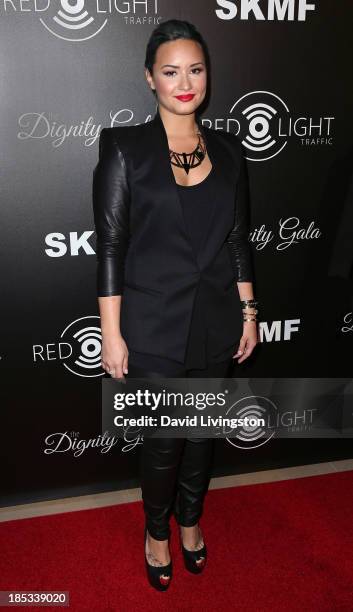 Singer Demi Lovato attends the launch of the Redlight Traffic app at the Dignity Gala at The Beverly Hilton Hotel on October 18, 2013 in Beverly...