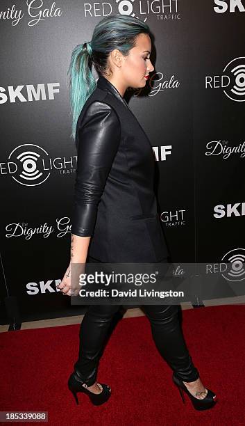 Singer Demi Lovato attends the launch of the Redlight Traffic app at the Dignity Gala at The Beverly Hilton Hotel on October 18, 2013 in Beverly...