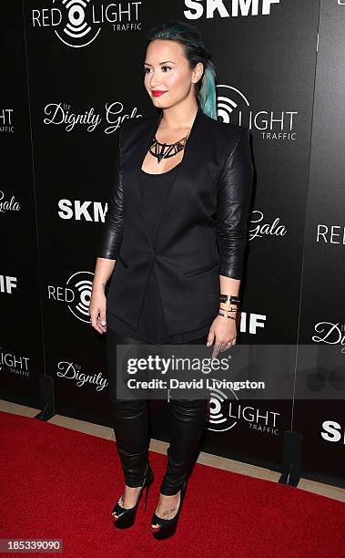 Singer Demi Lovato attends the launch of the Redlight Traffic app at the Dignity Gala at The Beverly Hilton Hotel on October 18, 2013 in Beverly...