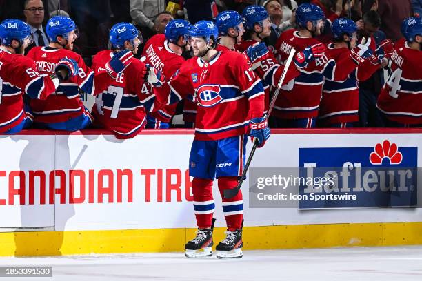 Montreal Canadiens right wing Josh Anderson celebrates his frist goal of the game with his teammates at the bench during the New York Islanders...