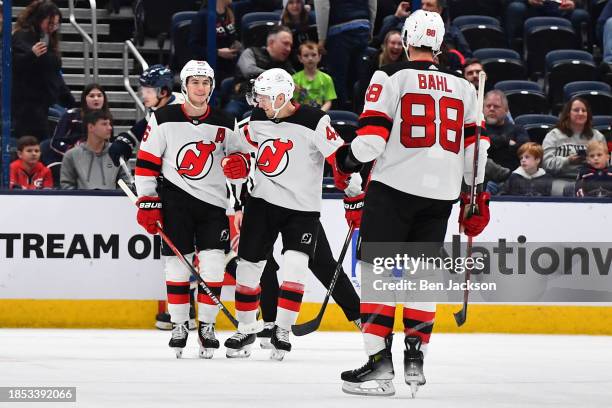 Jack Hughes of the New Jersey Devils celebrates his hat-trick goal with his teammates during the third period of a game against the Columbus Blue...