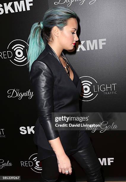 Singer Demi Lovato attends the launch of the Redlight Traffic app at the Dignity Gala at The Beverly Hilton Hotel on October 18, 2013 in Beverly...