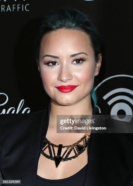 Singer Demi Lovato attends the launch of the Redlight Traffic app at the Dignity Gala at The Beverly Hilton Hotel on October 18, 2013 in Beverly...