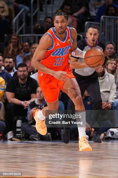 Aaron Wiggins of the Oklahoma City Thunder brings the ball up court against the Denver Nuggets on December 16, 2023 at the Ball Arena in Denver,...