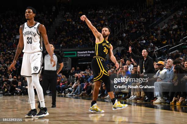 Stephen Curry of the Golden State Warriors looks on during the game against the Brooklyn Nets on December 16, 2023 at Chase Center in San Francisco,...