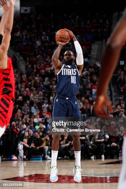 Tim Hardaway Jr. #10 of the Dallas Mavericks shoots a three point basket during the game on December 16, 2023 at the Moda Center Arena in Portland,...