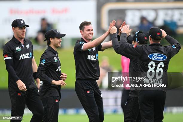 New Zealand's players celebrate the catch of Bangladesh's Soumya Sarka during the first one day international cricket match between New Zealand and...