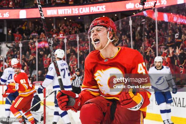 Connor Zary of the Calgary Flames celebrates after scoring the Tampa Bay Lightning during the third period an NHL game at Scotiabank Saddledome on...