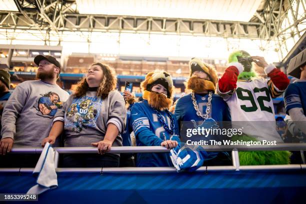 November 23 - Detroit Lions fans get ready to watch the players run out onto the field before the Thanksgiving game against the Green Bay Packers at...