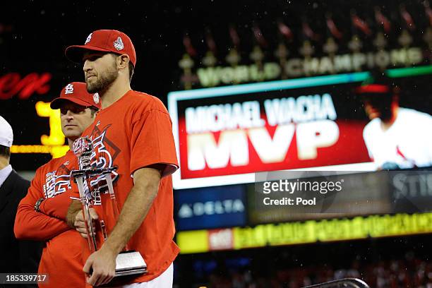 Michael Wacha of the St. Louis Cardinals celebrates with the NLCS MVP trophy after the Cardinals defeat the Los Angeles Dodgers 9-0 in Game Six of...