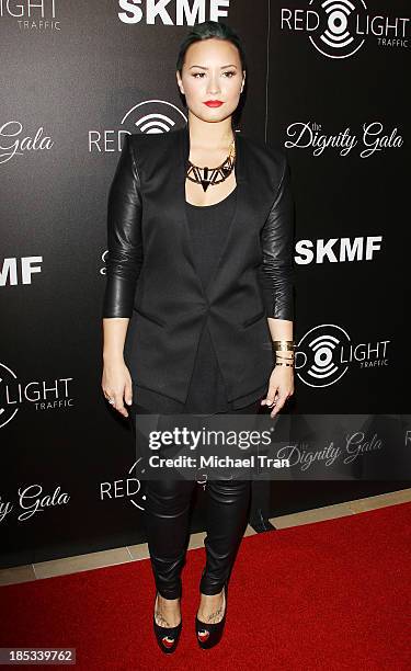 Demi Lovato arrives at the launch of the Redlight Traffic APP - Dignity Gala held at The Beverly Hilton Hotel on October 18, 2013 in Beverly Hills,...