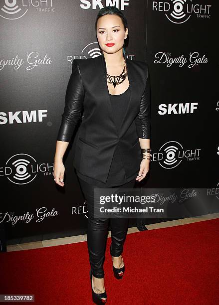 Demi Lovato arrives at the launch of the Redlight Traffic APP - Dignity Gala held at The Beverly Hilton Hotel on October 18, 2013 in Beverly Hills,...