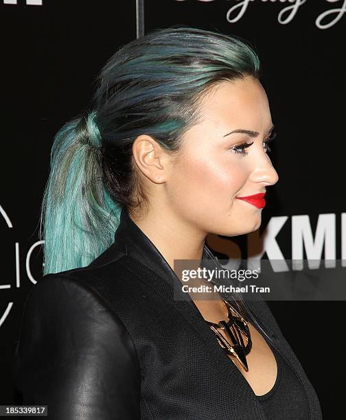 Demi Lovato arrives at the launch of the Redlight Traffic APP - Dignity Gala held at The Beverly Hilton Hotel on October 18, 2013 in Beverly Hills,...