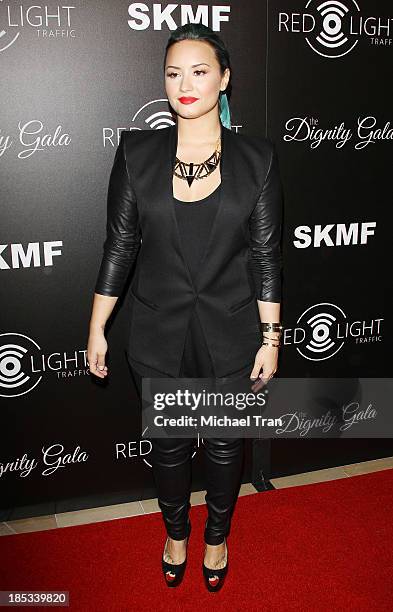 Demi Lovato arrives at the launch of the Redlight Traffic APP - Dignity Gala held at The Beverly Hilton Hotel on October 18, 2013 in Beverly Hills,...