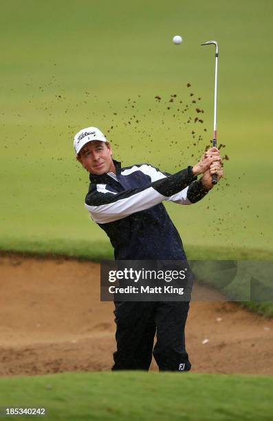 Brett Rumford of Australia plays out of the bunker on the 7th hole during day three of the Perth International at Lake Karrinyup Country Club on...