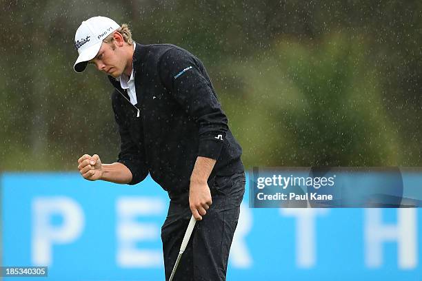 Hansen of Denmark celebrates securing par on the 17th hole during day three of the Perth International at Lake Karrinyup Country Club on October 19,...