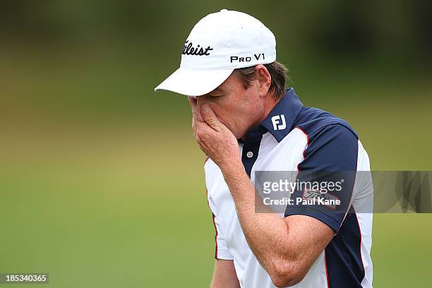 Brett Rumford of Australia reacts after bogeying his final hole during day three of the Perth International at Lake Karrinyup Country Club on October...