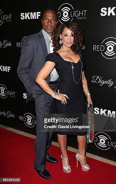 Former NFL player Willie Gault and wife actress Suzan Brittan attend the launch of the Redlight Traffic app at the Dignity Gala at The Beverly Hilton...