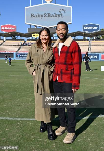 Chrissy Teigen and John Legend attend the 2023 Baby2Baby Holiday Distribution presented by FRAME & Nordstrom at Dodger Stadium on December 13, 2023...